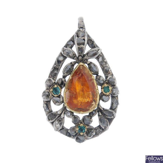 An early 19th century silver and gold, topaz, emerald and diamond pendant.