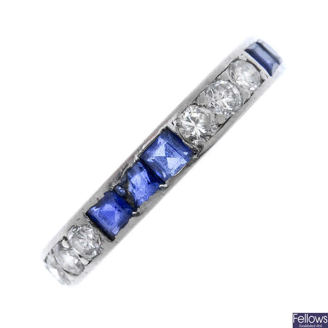 A mid 20th century diamond and sapphire full-circle eternity ring.