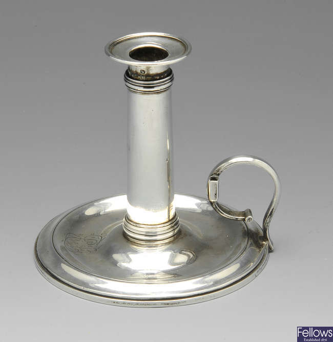 A George III silver miniature chamber stick.