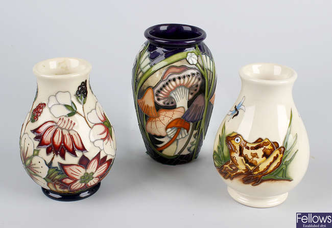 Three small Moorcroft vases.