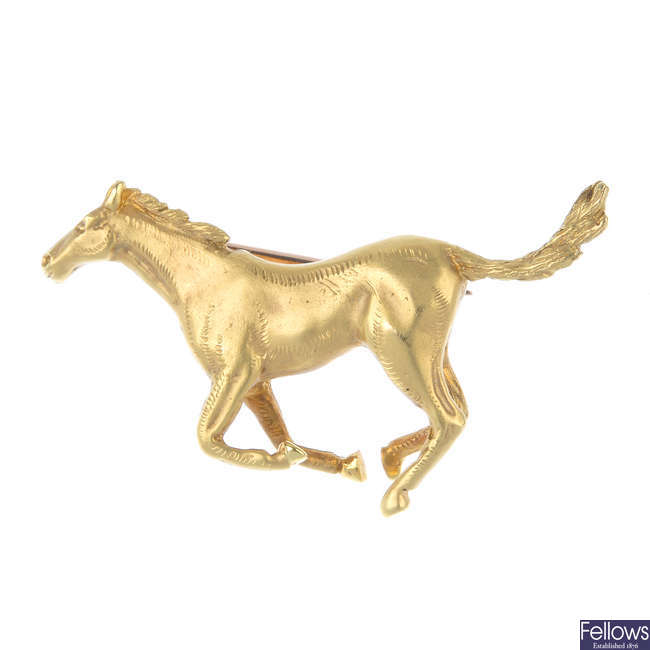 A 9ct gold horse brooch.