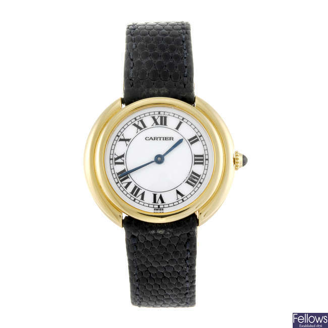CARTIER - a yellow metal Ellipse wrist watch.