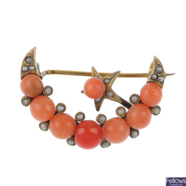 A late 19th century coral and seed pearl crescent and star brooch. 