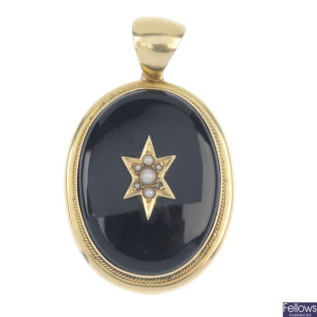 A late Victorian seed pearl and onyx memorial pendant.