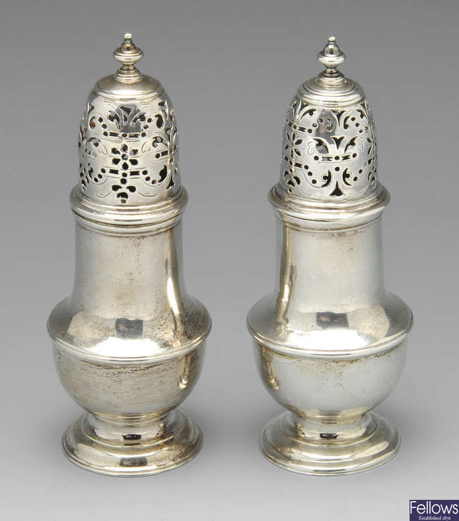 A pair of George II silver casters, etc.