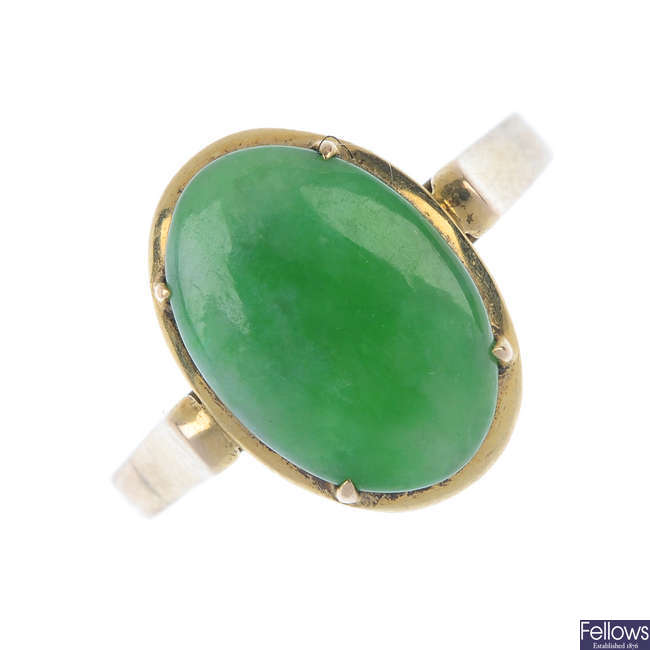A mid 20th century 14ct gold jade ring.