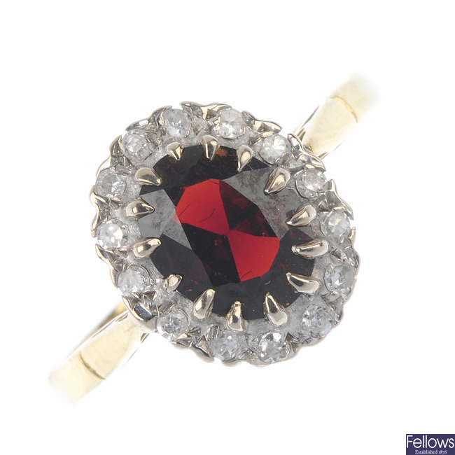 An 18ct gold diamond and garnet cluster ring.