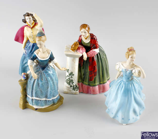A group of four Royal Doulton figures. 