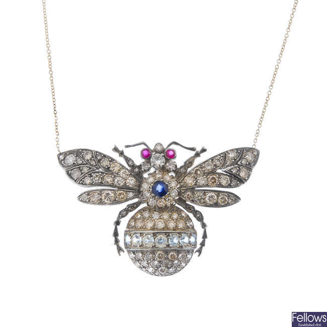 A gem-set bee pendant with chain.