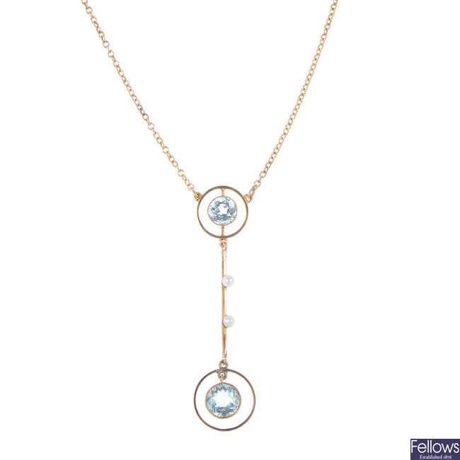 An early 20th century 9ct gold aquamarine and seed pearl pendant, on chain.
