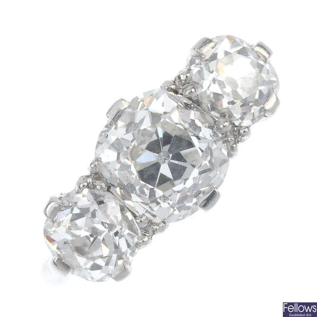 A mid 20th century diamond three-stone ring. 