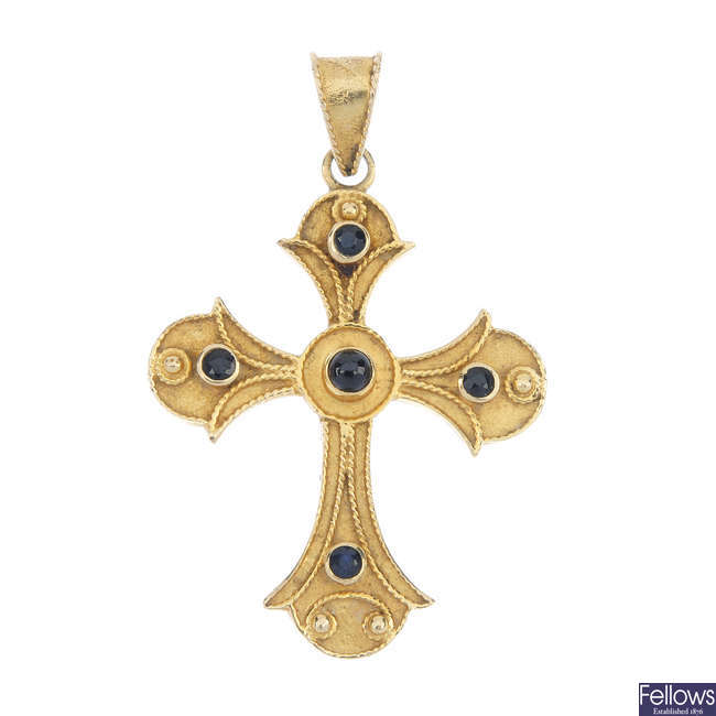 A sapphire cross pendant.