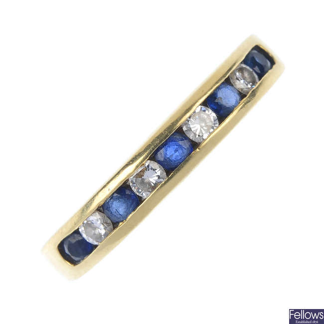 An 18ct gold sapphire and diamond half-circle eternity ring.