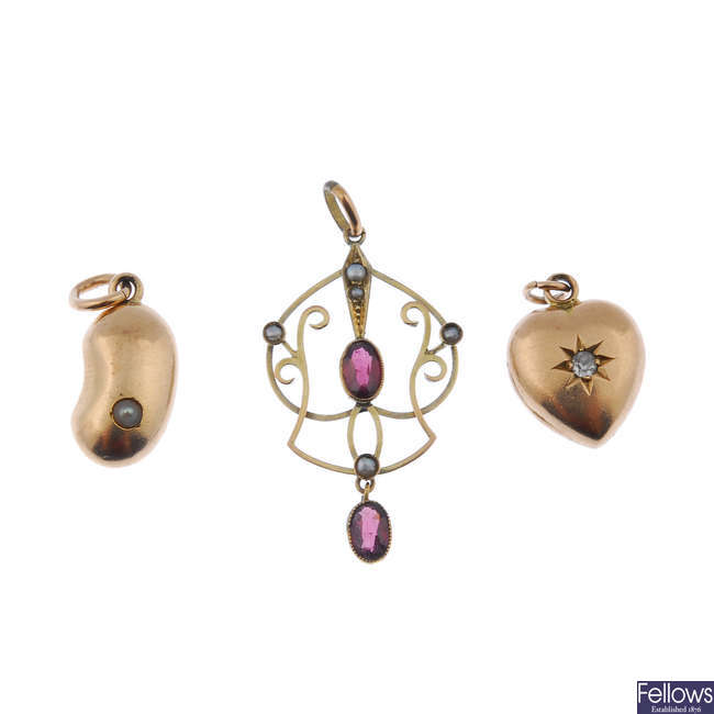 A selection of three early 20th century gold gem-set pendants.