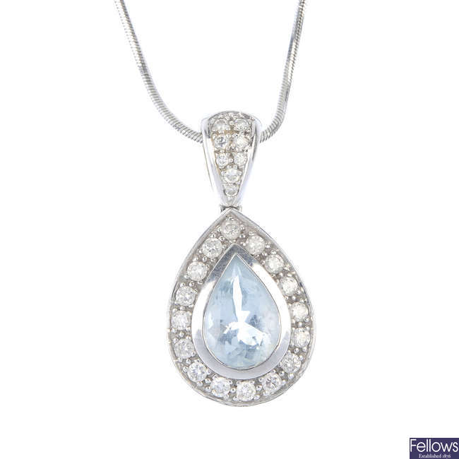 An aquamarine and diamond cluster pendant.