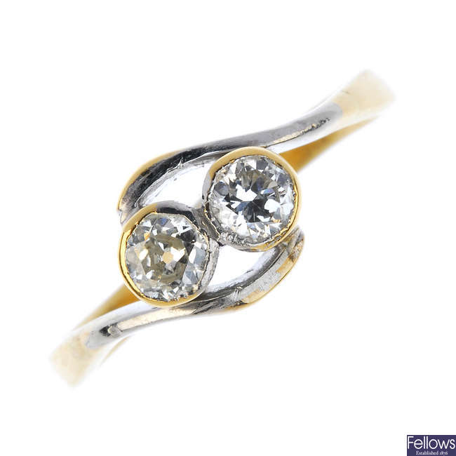 A mid 20th century 18ct gold diamond two-stone crossover ring. 