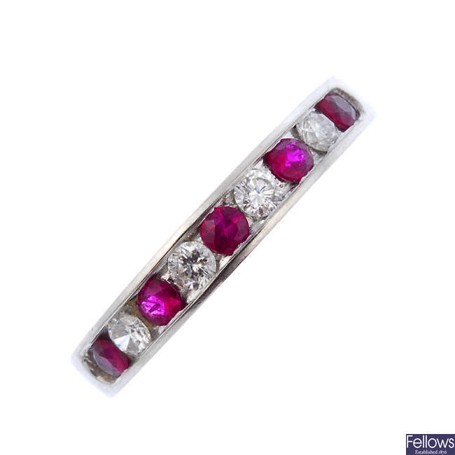 A ruby and diamond half-circle eternity ring.