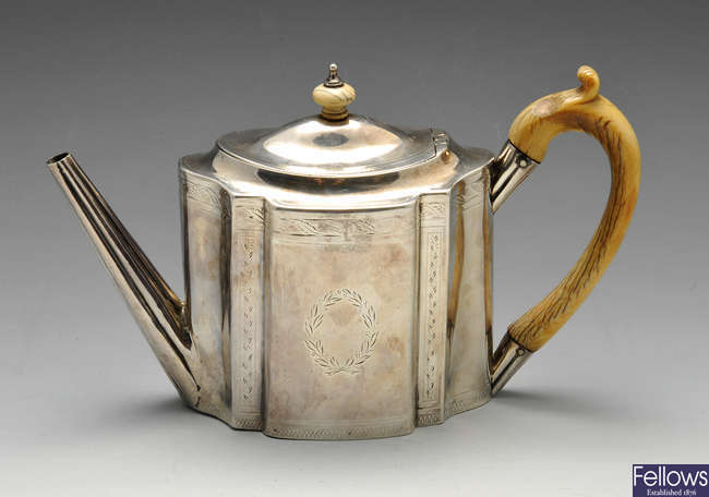 A George III silver teapot.