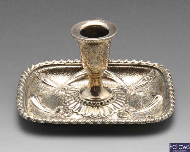 A George IV small silver chamberstick.