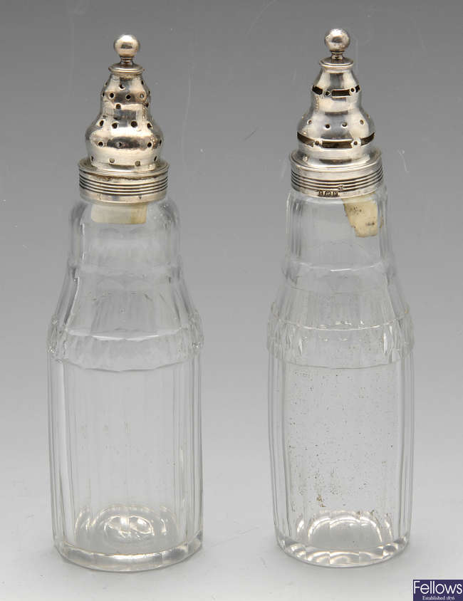 A pair of George III glass & silver casters.