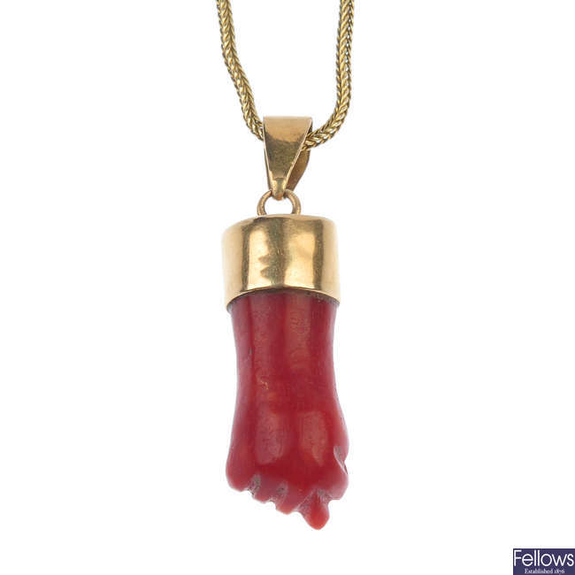 A late 19th century coral hand pendant and an Art Nouveau pendant. 