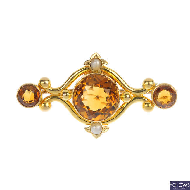 A late Victorian 15ct gold citrine and split pearl brooch, circa 1880.