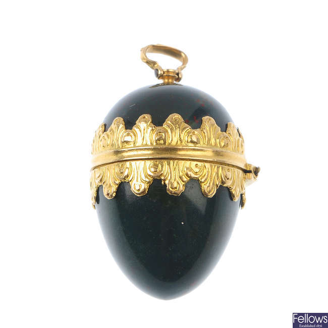A late 19th century hinged bloodstone and gold pendant.
