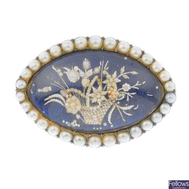 A mid 19th century 9ct gold split pearl memorial brooch.