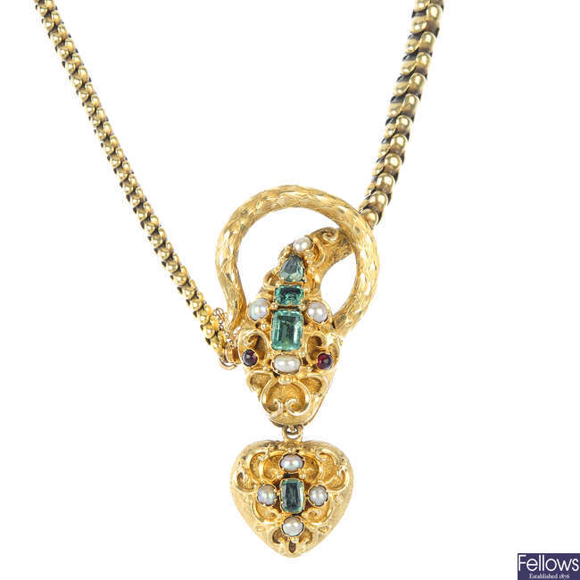 A mid 19th century gold and gem-set snake necklace, circa 1860. 