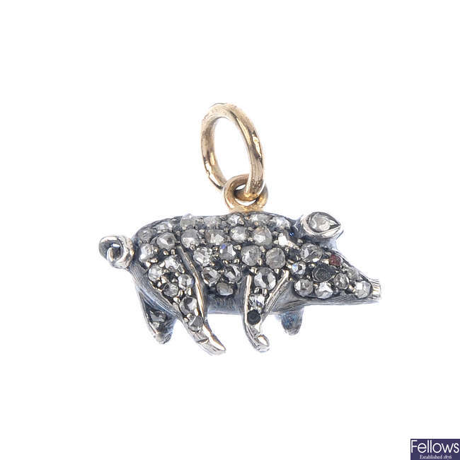A diamond and gem-set pig pendant.