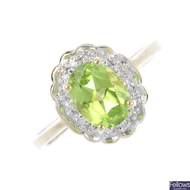 A 9ct gold peridot and diamond cluster ring.