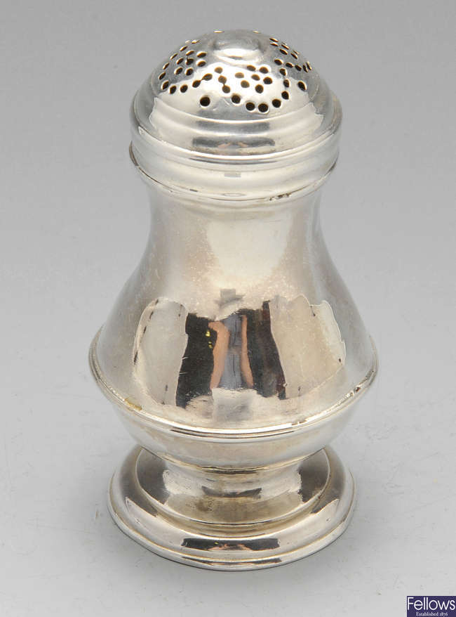 A small George II silver caster.