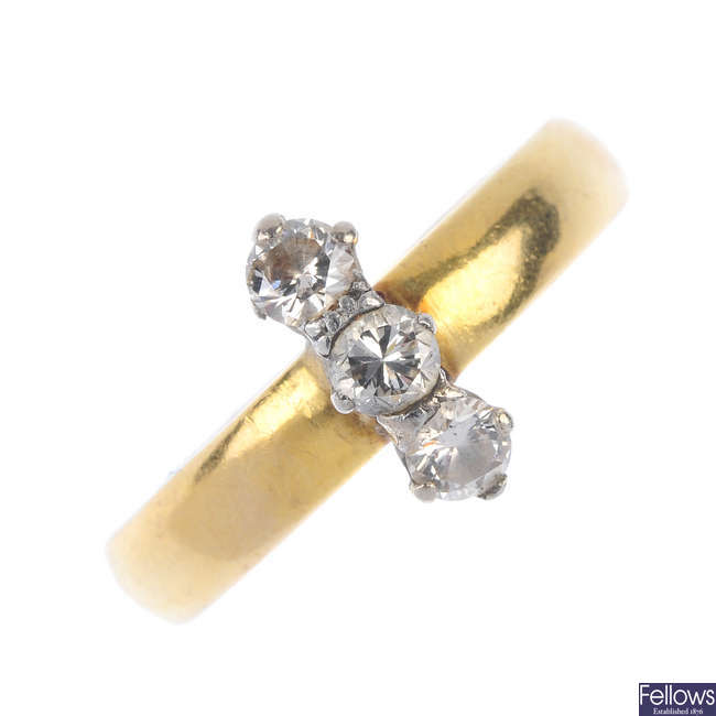 A 22ct gold diamond three-stone dress ring.