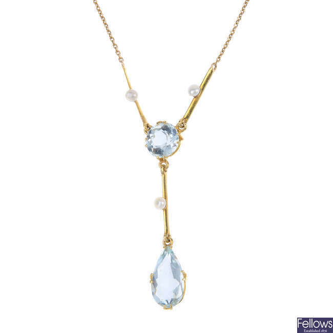 An early 20th century gold aquamarine and seed pearl necklace.