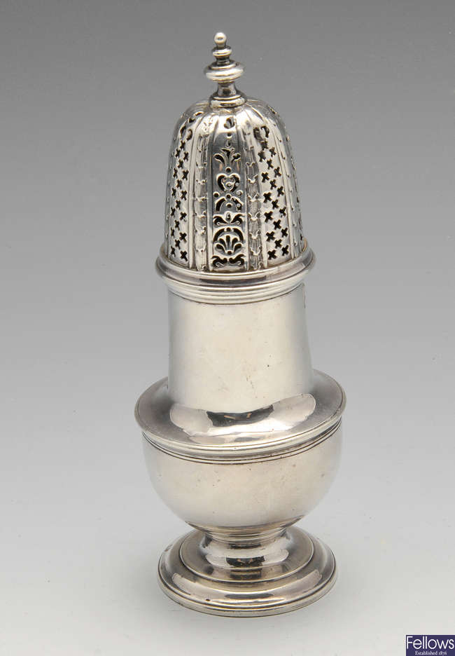 A George II silver caster of vase form with pierced cover and baluster finial. 