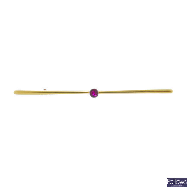 An early 20th century 15ct gold synthetic ruby bar brooch.