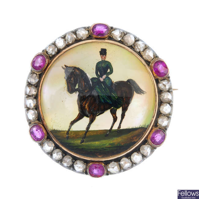 An early 20th century reverse-carved intaglio, diamond and ruby brooch.