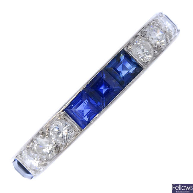 An 18ct gold sapphire and diamond half-circle eternity ring