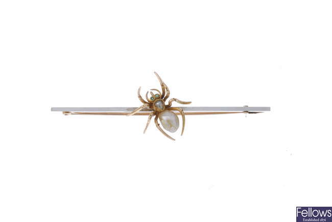 An early 20th century 15ct gold and platinum gem-set spider brooch.