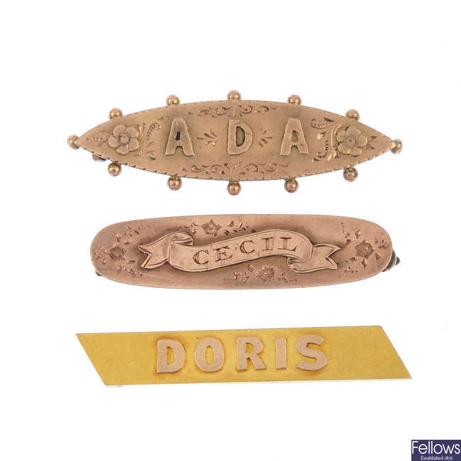 Three late 19th to early 20th century gold name badges.  