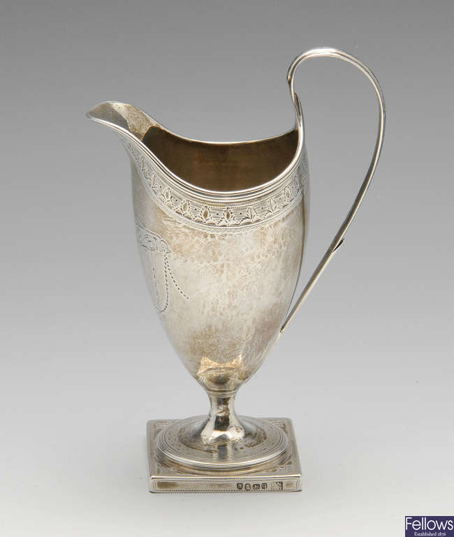 A George III silver helmet jug.