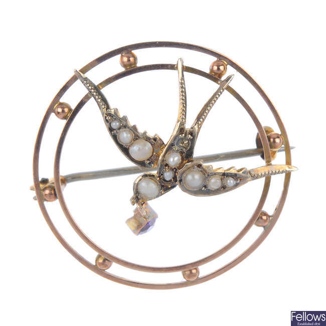 An early 20th century 9ct gold amethyst and split pearl swallow brooch.