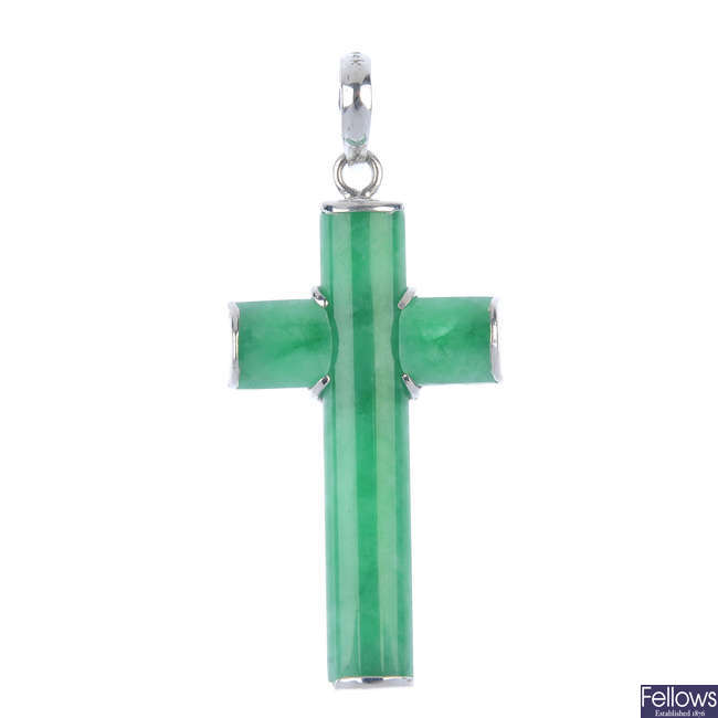 A jade cross pendant.