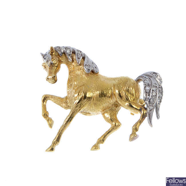 A diamond horse brooch.