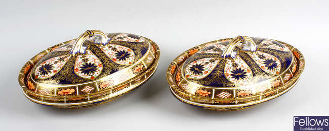A pair of Royal Crown Derby oval dishes and covers. 