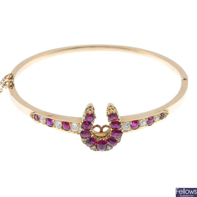 A late 19th century 18ct gold ruby and diamond hinged bangle.