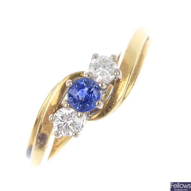 An 18ct gold sapphire and diamond crossover ring.