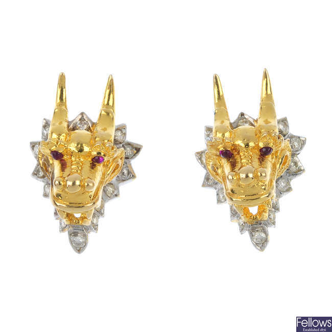 A pair of diamond dragon earrings. 