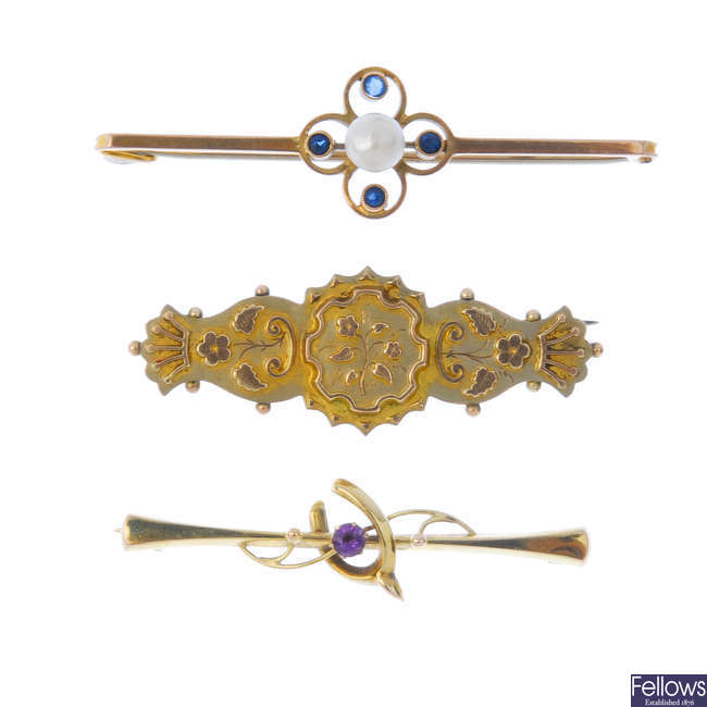 Five late 19th to early 20th century gold brooches.