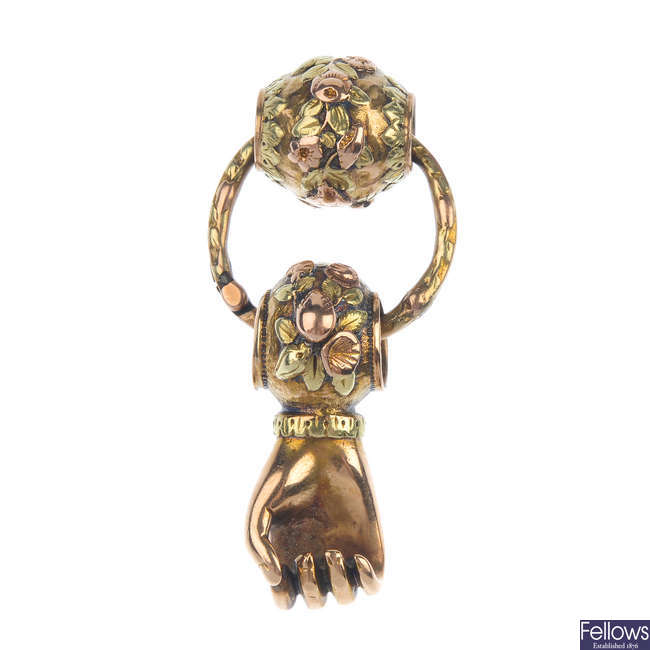 An early 19th century 18ct gold Figa fist pendant.